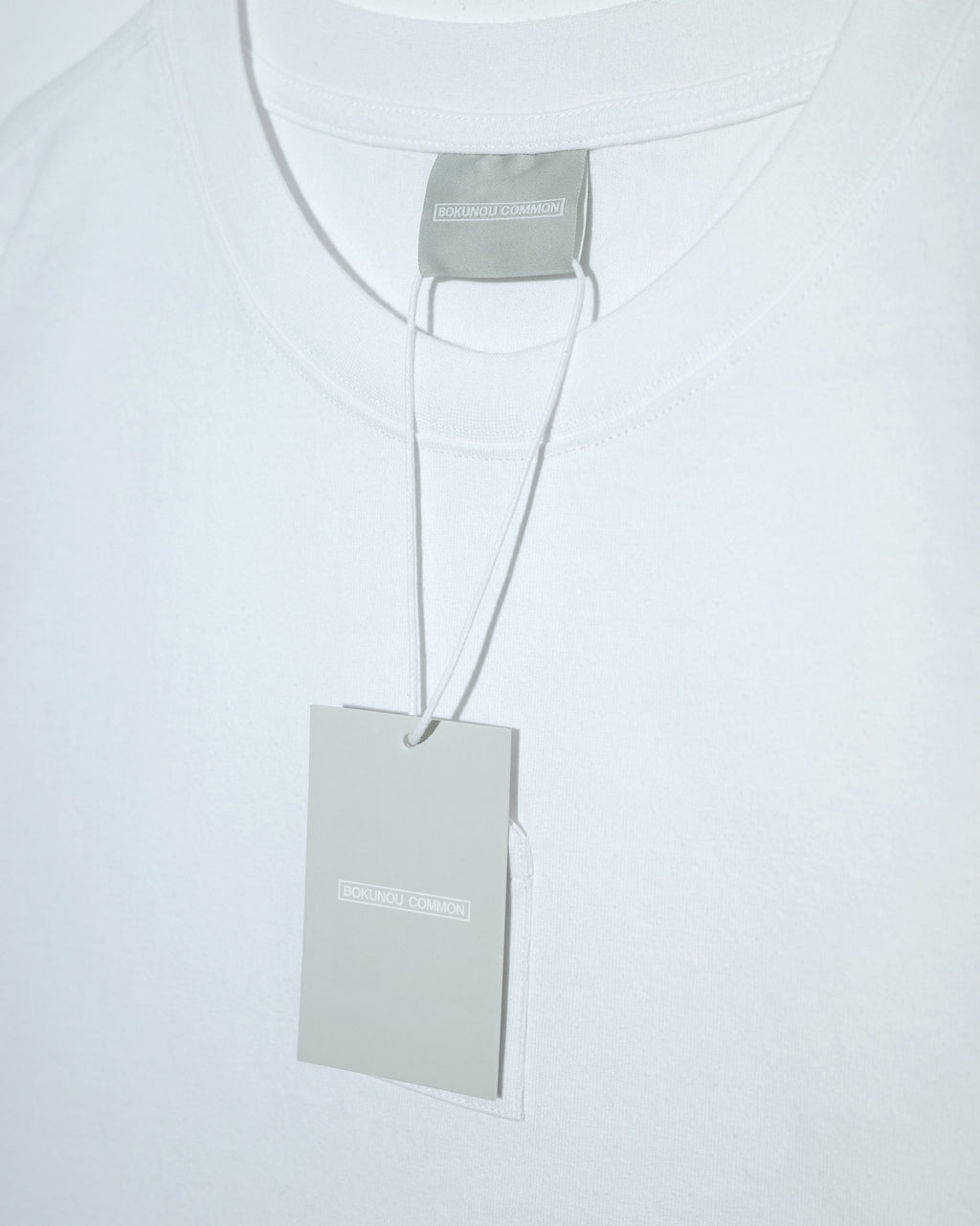 BOKUNOU COMMON OMAMORI POCKET S/S TEE BNCM-101T WHITE